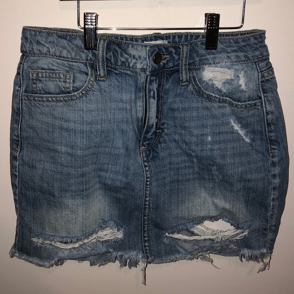 Short ripped jean skirt.